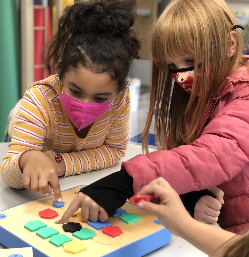 kids solving puzzle